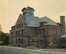 Corner view of the Former Summerside Post Office, showing the façade with the main entrances and a side, 1982.; Parks Canada Agency/ Agence Parcs Canada, 1982.