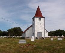 Photo of St. John the Evangelist Cemetery with church in the background.  View looking west, photo taken 2004.; Deborah O'Rielly/ HFNL 2007