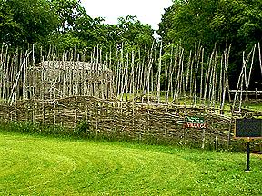 View of the Reconstructed  Palisade and Longhouse 
