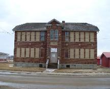 View of the front facade showing the regular massing and projecting tower.; Mike Fedyk, 2007.