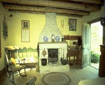 Interior view of the kitchen showing the fireplace at the west end of the house – August 2005; OHT, 2005