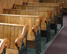 View of the cast iron detailing on the north side pews of the Griswold United Church, Griswold, 2005; Historic Resources Branch,  Manitoba Culture, Heritage and Tourism, 2005