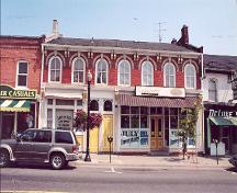 View of main (south) façade showing overall massing and proportions – July 2001; OHT, 2001