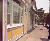 View of main (south) façade looking east on the north side of King Street West – July 2001; OHT, 2001