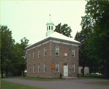 Corner view of Oxford-on-Rideau Township Hall National Historic Site of Canada, showing both front and side elevations, 1980.; Parks Canada Agency / Agence Parcs Canada, 1980.