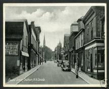 Cunard Street, Ken Breau's barber shop on right, barber post in front, circa 1940's.; City of Miramichi
