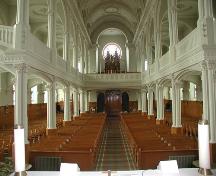View toward the entrance of the church, Paroisse Saint-Pierre, Chéticamp, NS, 2002.; Inverness County Heritage Advisory Committe, 2002