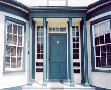 View of main entrance showing Doric columns, wooden door, sidelights and transom – July 2003; OHT, 2003