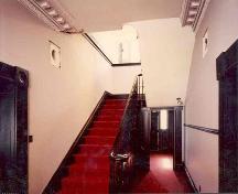 View of the main floor hallway and stairs; OHT