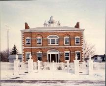 View of the front of McMartin House including fence; OHT