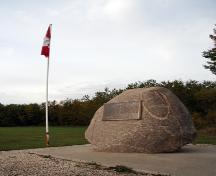 Site view, from the northeast, of the boulder bearing the commemorative plaque at the Opawaka School Site, Miami area, 2006; Historic Resources Branch, Manitoba Culture, Heritage and Tourism, 2006