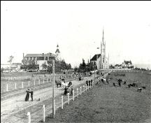 Historic view of Pointe-à-Jacquot, looking west. The former Saint-Jean-Baptiste Church is in the centre of the photograph.  Image taken in 1893.; Centre d'études acadiennes - PB2-14