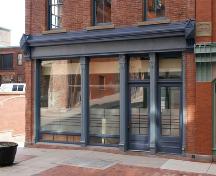 This image shows the restored street-level storefront.; Commercial Properties Limited