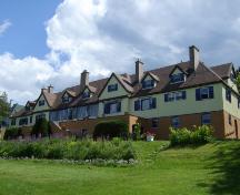 This photograph illustrates the rear view of the building showing its cross gables, dormers, and chimneys, 2007; Town of St. Andrews