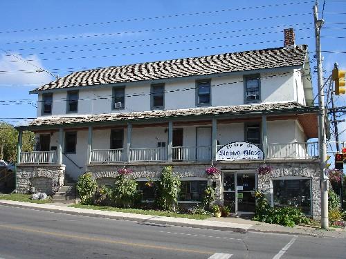 Front facade of 157-161 Queen St. E.