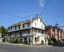 157-161 Queen St. E. in context on the corner of Queen and Montreal Streets, Kingston ON; RHI 2006