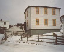View of front facade of house and root cellar, Edwin and Priscilla Miller House, New Bonaventure.; HFNL 2005