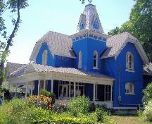 Bampfield Hall is easily recognizable by its Gothic features and bright blue exterior.; Photograph by Katie Hemsworth, 2007.