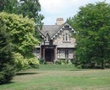 Featured is the double-gable stone façade with decorative bargeboard.; Kendra Green, 2007.