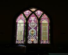 View of one of the stained-glass windows in Frikirkju (Bru) Lutheran Church, Cypress River area, 2005; Historic Resources Branch, Manitoba Culture, Heritage, Tourism and Sport, 2005