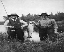 This image shows Dr. Clarke on the left, along with a guide, on a fishing excursion, circa 1920's-1930's.; G. F. Clarke Estate, restored by Mary Bernard