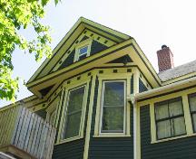 Bay window capped with a gabled roof dormer; Town of Sussex