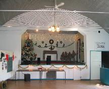 View of stage at north end of hall, 2004.; Government of Saskatchewan, Marvin Thomas, 2004.