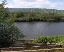 This photo shows the site of the sluice, facing Mont Farlagne, located on the opposite side of the Madawaska River; Madawaska Historical Society