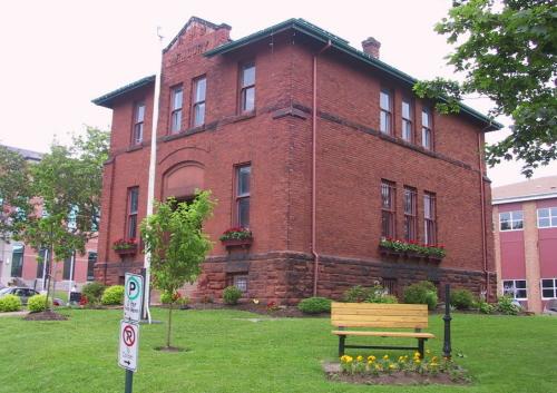 Showing former armoury on landscaped grounds