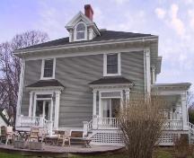 Showing south elevation with patio; Wyatt Heritage Properties, 2003