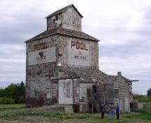 View depicts elevator, receiving shed and office, June 2003; Government of Saskatchewan, Flaman, 2003.