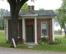 Front showing portico, surrounding fields and mature trees – 2004; OHT, 2004