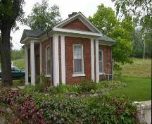 Oblique view of the front showing part of the original entrance wall (at bottom) – 2004; OHT, 2004