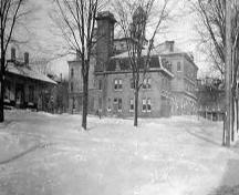 Fire Hall's south elevation showing Victoria Hall in the background and Market to the left – 1913; Cobourg Public Library – Accession  # 720-121