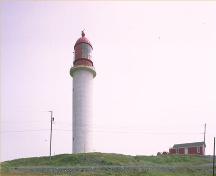 General view of the Cape Race Lighthouse National Historic Site of Canada, showing the stone and reinforced concrete construction, 1990.; Parks Canada Agency / Agence Parcs Canada, 1990.
