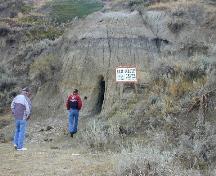 Entrance to cave where outlaws reportedly hid from the authorities, 2003.; Government of Saskatchewan, Carlos Germann, 2003.