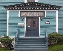 This photograph shows the entrance, transom window and pediment decorated with dentils, 2005; City of Saint John