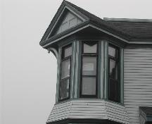 This photograph shows the irregular placement of the bay with multiple windows and crowned by a pediment, 2005; City of Saint John