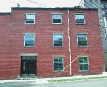 This photograph shows the front façade of the building, 2005; City of Saint John
