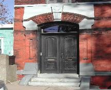 This photograph shows the segmented arch entranceway, 2005; City of Saint John