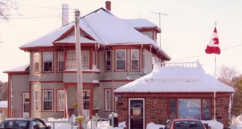 East elevation with office on the right with flag