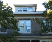 This photograph shows the eave and the central dormer, and illustrates a double-set 6/1 window, 2005; City of Saint John