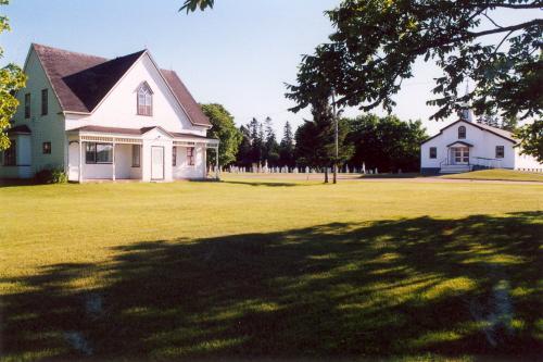 Showing side elevation with bay window on left