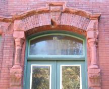 This photograph shows the entablature over small columns and pilasters, 2005; City of Saint John