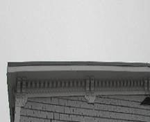 This image provides a view of the bracketed wood cornice ornamented by dentils and other decorative wood work, 2005; City of Saint John