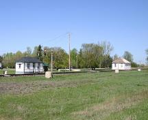 Contextual view, from the southeast, of the Ridgeway House (right) and Gunton Waiting Station (left), Grosse Isle, 2007; Historic Resources Branch, Manitoba Culture, Heritage, Tourism and Sport, 2007