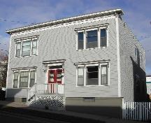 This photograph shows the contextual view of the building on Orange Street, 2005; City of Saint John