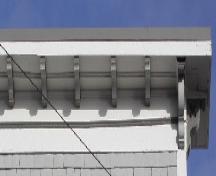 This image provides a view of the large cornice ornamented by modillions and supported by decorative brackets, 2005; City of Saint John