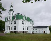 This image of the Second Empire Building shows the cut-stone foundation and the main portico opening onto the ground floor.; PNB 2005