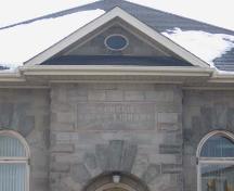 The inscription in the front gable references this library's history as a Carnegie Library, 2007.; Lindsay Benjamin, 2007.